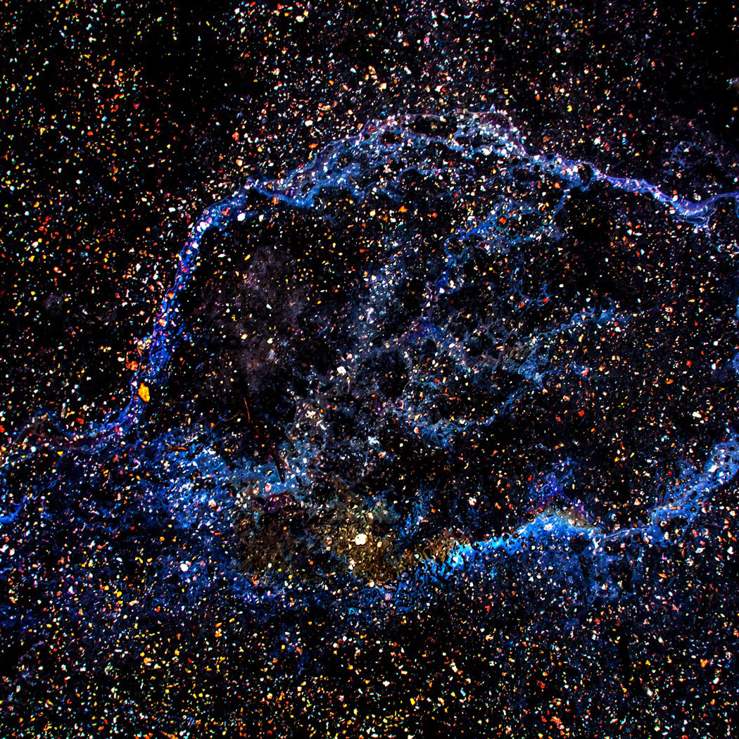 Juha Tanhua’s Photography Turns Parking Lot Oil Spills Into Galaxies – COOL HUNTING®